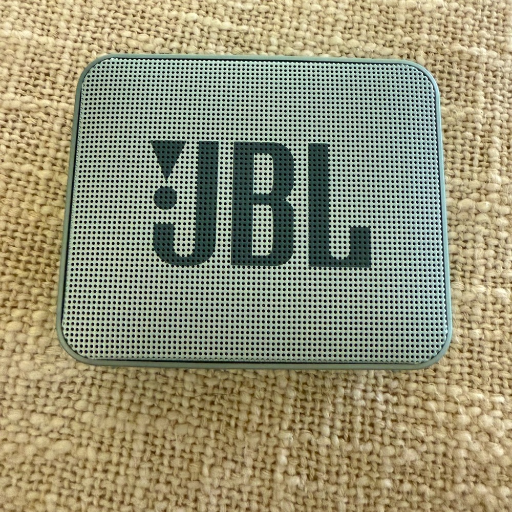 JBL Go 2 is an ultra-compact portable Bluetooth speaker. Grey color .